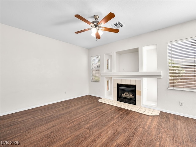 1153 Stormy Valley Rd, Las Vegas, NV 89123 - unfurnished living room with ceiling fan, wood finished floors, baseboards, and a tiled fireplace