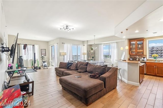 8255 Las Vegas Blvd Unit 713, Las Vegas, NV 89123 - living area featuring light wood-style flooring, baseboards, and indoor wet bar