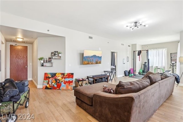 8255 Las Vegas Blvd Unit 713, Las Vegas, NV 89123 - living room with baseboards, visible vents, and light wood-type flooring