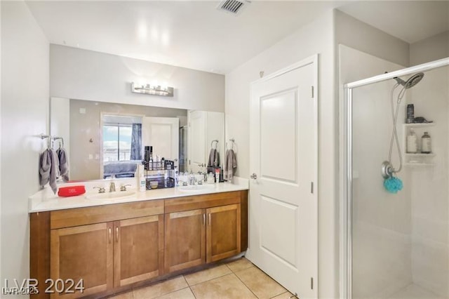 8255 Las Vegas Blvd Unit 713, Las Vegas, NV 89123 - bathroom featuring a sink, double vanity, a stall shower, and visible vents