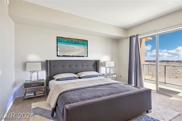 8255 Las Vegas Blvd Unit 713, Las Vegas, NV 89123 - bedroom with carpet, baseboards, and access to exterior