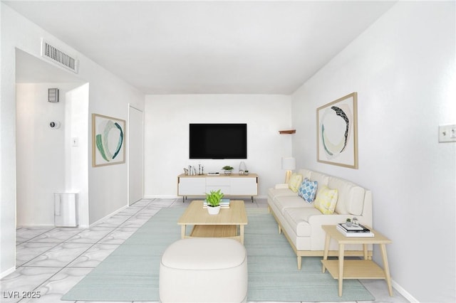 living room with visible vents and baseboards