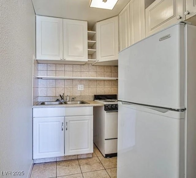 kitchen with open shelves, backsplash, a sink, and white appliances
