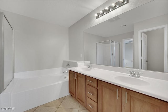 2749 Invermark St, Henderson, NV 89044 - full bath with double vanity, a garden tub, a shower stall, and tile patterned flooring