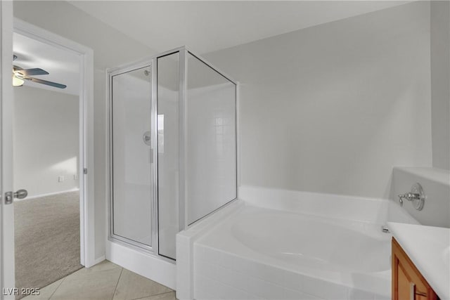 2749 Invermark St, Henderson, NV 89044 - bathroom featuring a stall shower, a bath, vanity, ceiling fan, and tile patterned floors