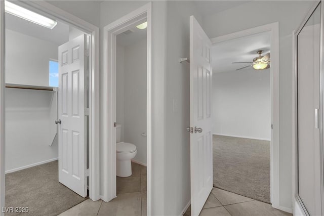2749 Invermark St, Henderson, NV 89044 - bathroom featuring tile patterned floors, a ceiling fan, and a spacious closet