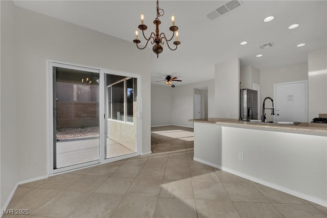 2749 Invermark St, Henderson, NV 89044 - kitchen featuring a chandelier, light tile patterned floors, and recessed lighting