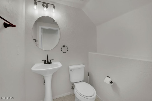 2749 Invermark St, Henderson, NV 89044 - half bath featuring vaulted ceiling and tile patterned flooring