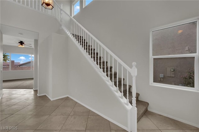 2749 Invermark St, Henderson, NV 89044 - staircase with tile patterned floors, a towering ceiling, and ceiling fan