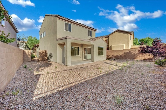 2749 Invermark St, Henderson, NV 89044 - rear view of property featuring stucco siding, a fenced backyard, and a patio