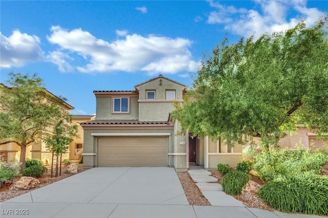 2749 Invermark St, Henderson, NV 89044 - mediterranean / spanish-style home featuring a garage, driveway, and stucco siding