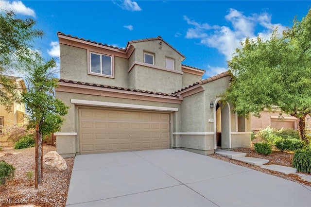 2749 Invermark St, Henderson, NV 89044 - mediterranean / spanish home with stucco siding, driveway, an attached garage, and a tile roof