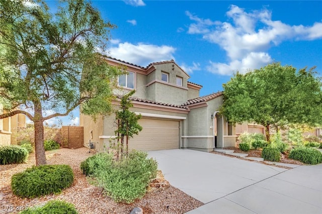 2749 Invermark St, Henderson, NV 89044 - mediterranean / spanish home featuring concrete driveway, stucco siding, a tiled roof, and a garage