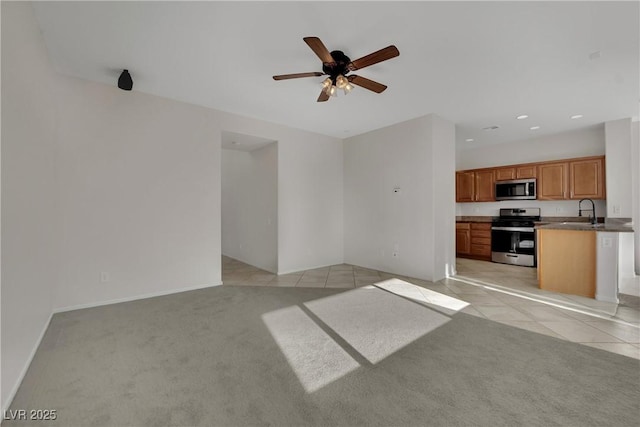 2749 Invermark St, Henderson, NV 89044 - unfurnished living room featuring light colored carpet, ceiling fan, recessed lighting, and light tile patterned flooring