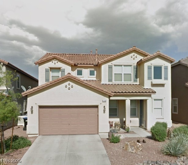 1180 Hollow Reed Ct, Henderson, NV 89011 - view of front of property featuring a tile roof, stucco siding, driveway, a porch, and an attached garage