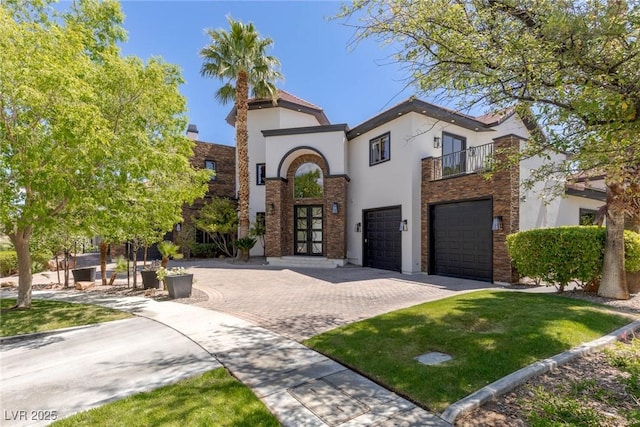 9501 Balatta Canyon Ct, Las Vegas, NV 89144 - mediterranean / spanish-style house featuring a balcony, french doors, decorative driveway, an attached garage, and stucco siding