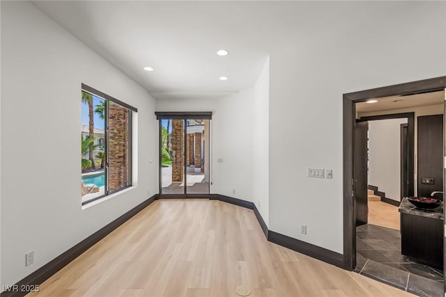 9501 Balatta Canyon Ct, Las Vegas, NV 89144 - spare room with baseboards, recessed lighting, and wood finished floors
