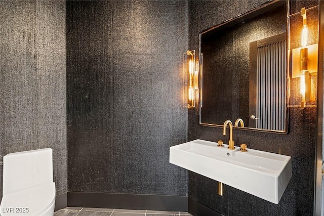9501 Balatta Canyon Ct, Las Vegas, NV 89144 - bathroom featuring tile patterned floors, toilet, and a sink
