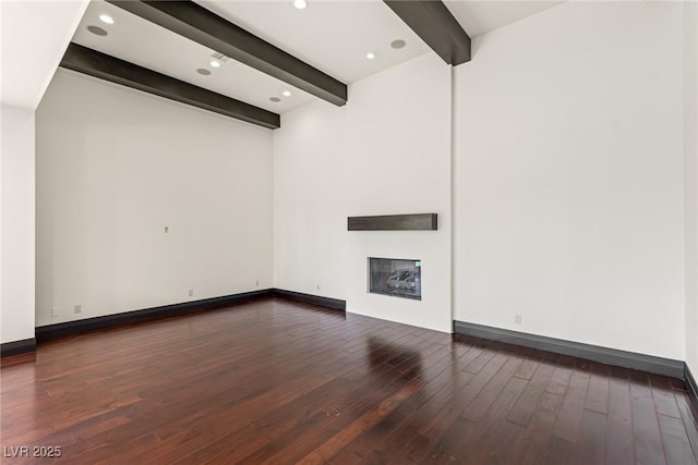 9501 Balatta Canyon Ct, Las Vegas, NV 89144 - interior space with beam ceiling, baseboards, a glass covered fireplace, and hardwood / wood-style flooring