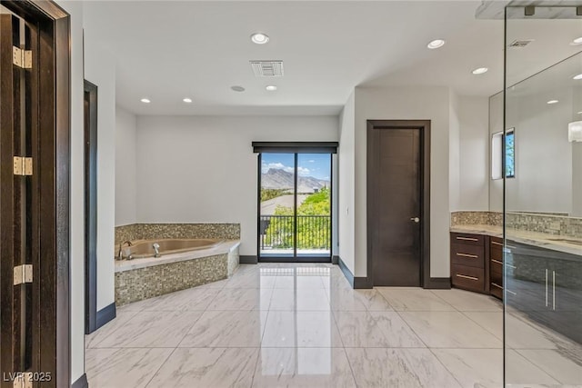 9501 Balatta Canyon Ct, Las Vegas, NV 89144 - full bath featuring recessed lighting, baseboards, visible vents, a garden tub, and vanity