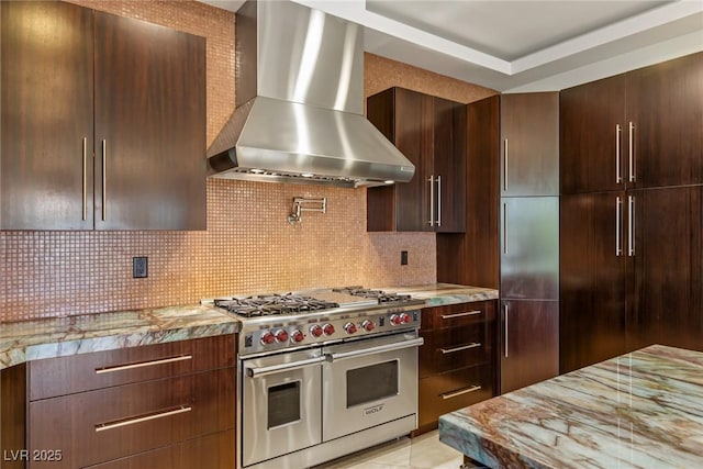 9501 Balatta Canyon Ct, Las Vegas, NV 89144 - kitchen with double oven range, wall chimney exhaust hood, light stone countertops, and tasteful backsplash