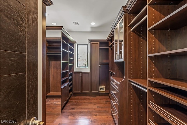 9501 Balatta Canyon Ct, Las Vegas, NV 89144 - spacious closet featuring visible vents and dark wood-type flooring