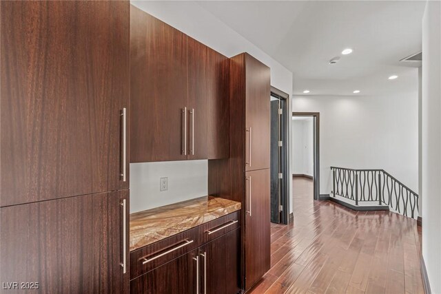9501 Balatta Canyon Ct, Las Vegas, NV 89144 - corridor featuring an upstairs landing, wood finished floors, baseboards, and recessed lighting