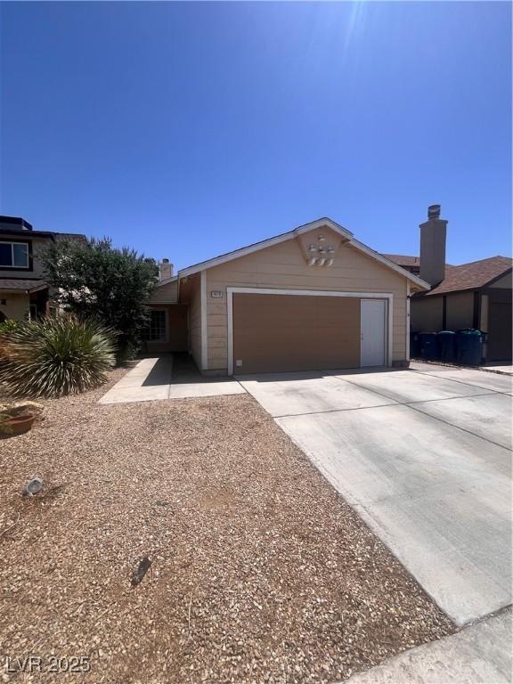 1676 Divinity St, Las Vegas, NV 89142 - ranch-style home with a garage and driveway
