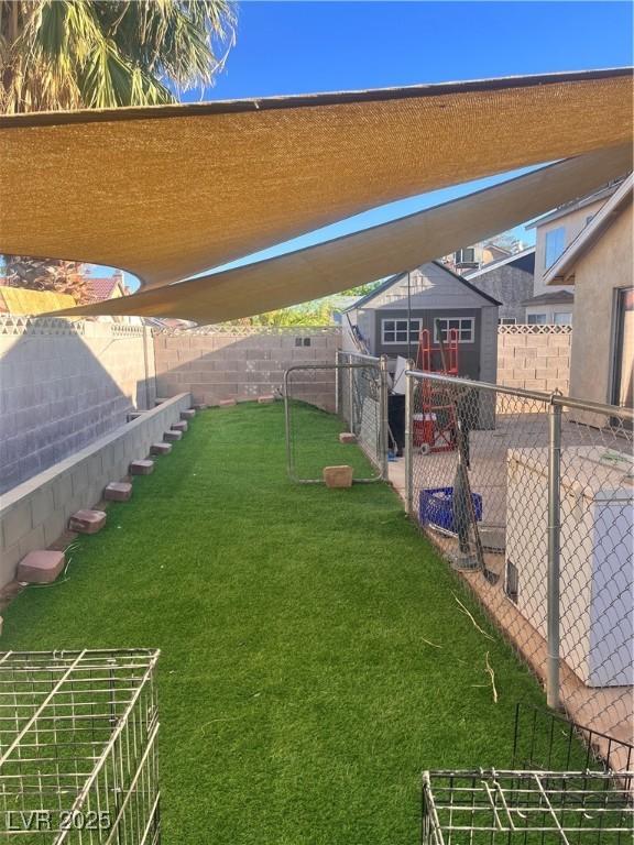 1676 Divinity St, Las Vegas, NV 89142 - view of yard featuring a patio area