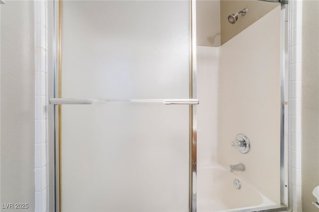 full bathroom with shower / bath combination with glass door