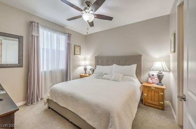 8257 Skye Peak St, Las Vegas, NV 89166 - bedroom with light carpet, baseboards, and a ceiling fan
