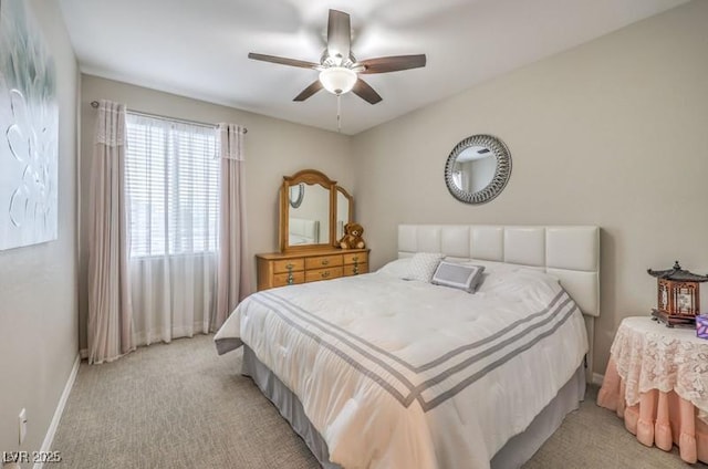 8257 Skye Peak St, Las Vegas, NV 89166 - bedroom with light carpet, baseboards, and a ceiling fan