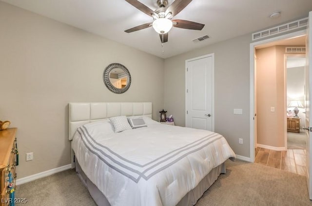 8257 Skye Peak St, Las Vegas, NV 89166 - bedroom featuring light colored carpet, baseboards, and a ceiling fan