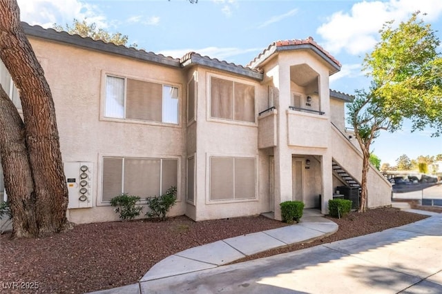3066 Tarpon Dr Unit 204, Las Vegas, NV 89120 - view of building exterior with central AC unit and stairway