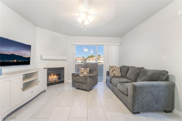 3066 Tarpon Dr Unit 204, Las Vegas, NV 89120 - living room with a ceiling fan, a glass covered fireplace, and light tile patterned floors