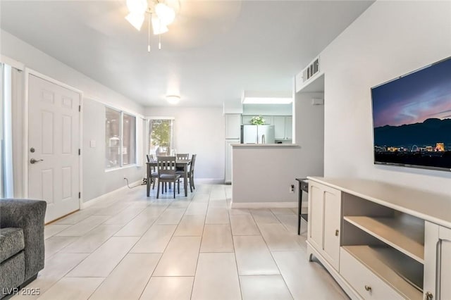 3066 Tarpon Dr Unit 204, Las Vegas, NV 89120 - dining room with a ceiling fan, baseboards, light tile patterned floors, and visible vents