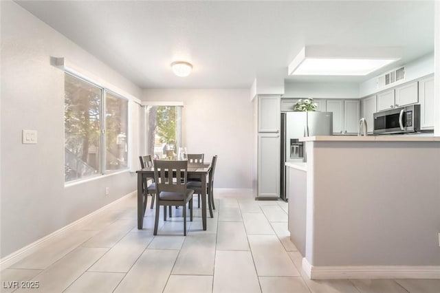 3066 Tarpon Dr Unit 204, Las Vegas, NV 89120 - dining room featuring baseboards, visible vents, and light tile patterned flooring