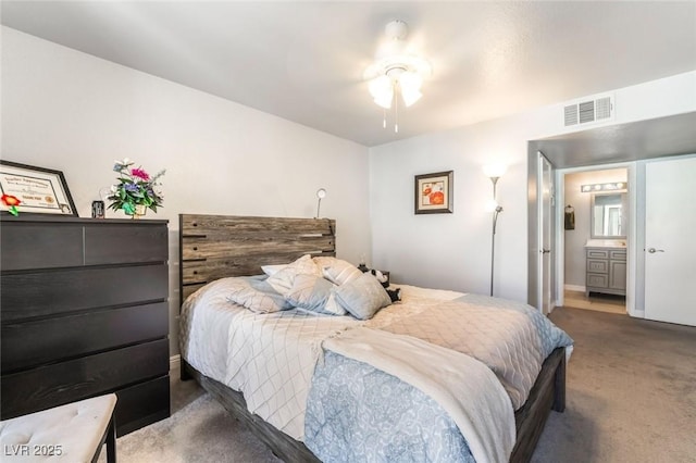3066 Tarpon Dr Unit 204, Las Vegas, NV 89120 - carpeted bedroom featuring ensuite bath, visible vents, and baseboards