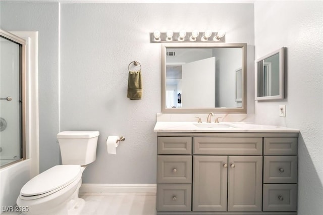 3066 Tarpon Dr Unit 204, Las Vegas, NV 89120 - bathroom featuring toilet, baseboards, enclosed tub / shower combo, visible vents, and vanity