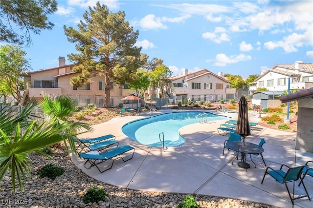3066 Tarpon Dr Unit 204, Las Vegas, NV 89120 - pool with a patio area, a residential view, and fence