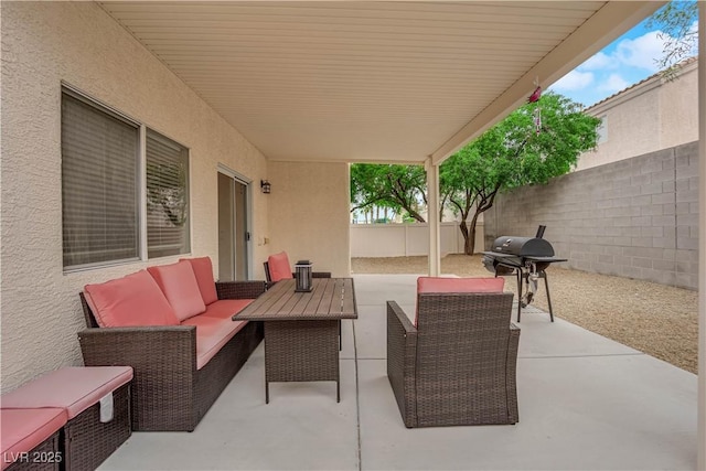 view of patio / terrace featuring a grill, a fenced backyard, and an outdoor living space