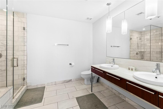 full bathroom featuring toilet, visible vents, a stall shower, and a sink