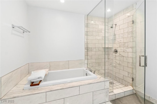 full bath with a shower stall, a garden tub, and recessed lighting