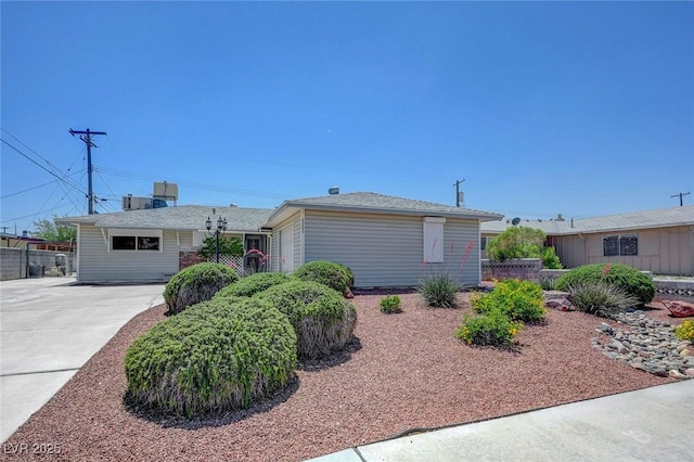 single story home featuring fence and driveway