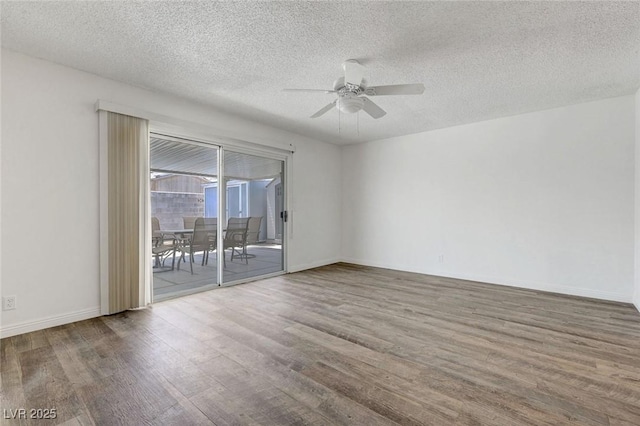 unfurnished room featuring wood finished floors, a ceiling fan, a textured ceiling, and baseboards