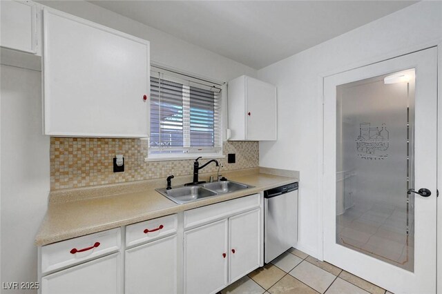 kitchen featuring dishwasher, a sink, tasteful backsplash, white cabinets, and light countertops