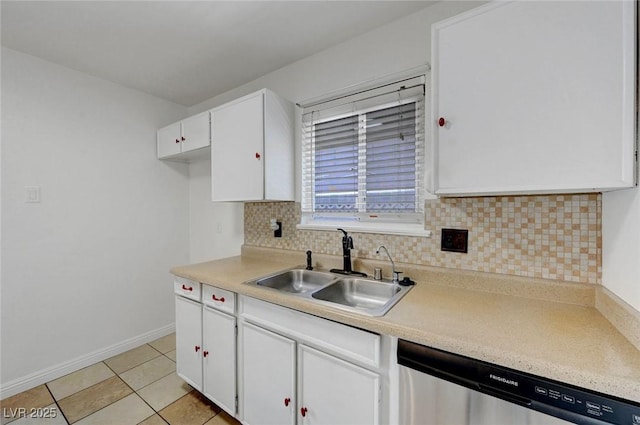 kitchen featuring dishwasher, a sink, white cabinetry, and tasteful backsplash