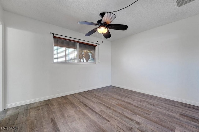 unfurnished room with wood finished floors, a textured ceiling, ceiling fan, and baseboards