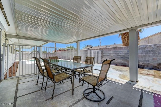 view of patio with a fenced backyard and outdoor dining space