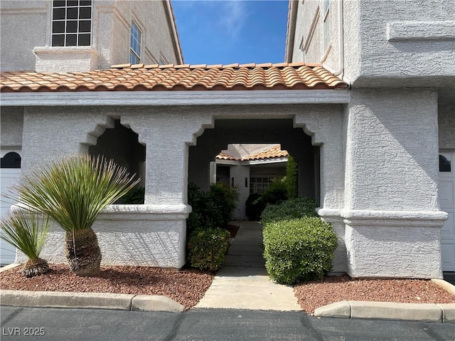5201 S Torrey Pines Dr Unit 1253, Las Vegas, NV 89118 - doorway to property with a tile roof and stucco siding